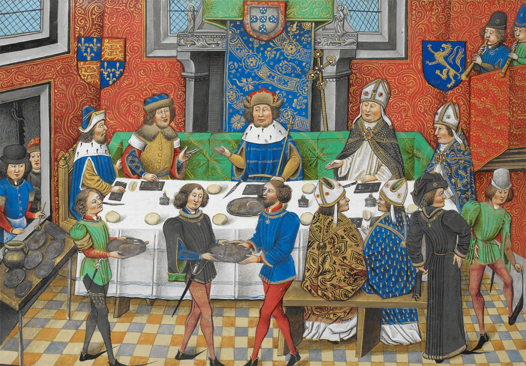 Colorful illuminated manuscript miniature depicting male diners in the middle ages seated at a table. Servants carry food on platters in the foreground.