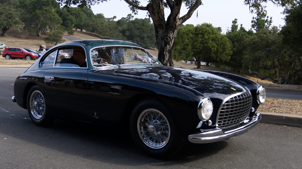 View of a black 2-door sports car from the front right side