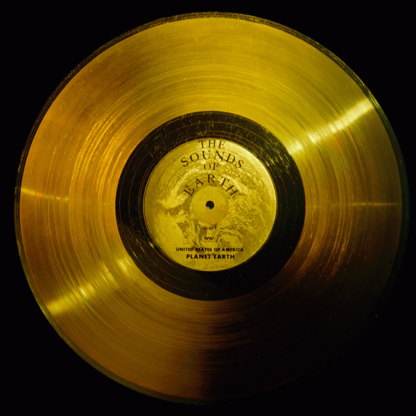 A gold record album with a label that reads "The Sounds of Earth" at top and "United States of America / Planet Earth" on the bottom.